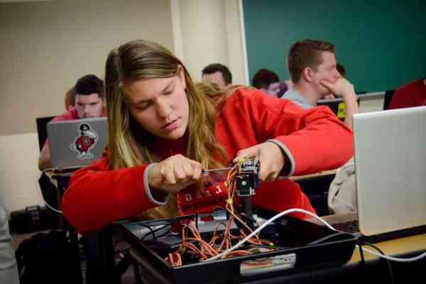 A student works with electronics in class